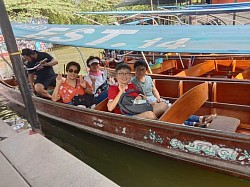 Charter a van to Damnoen Saduak Floating Market.